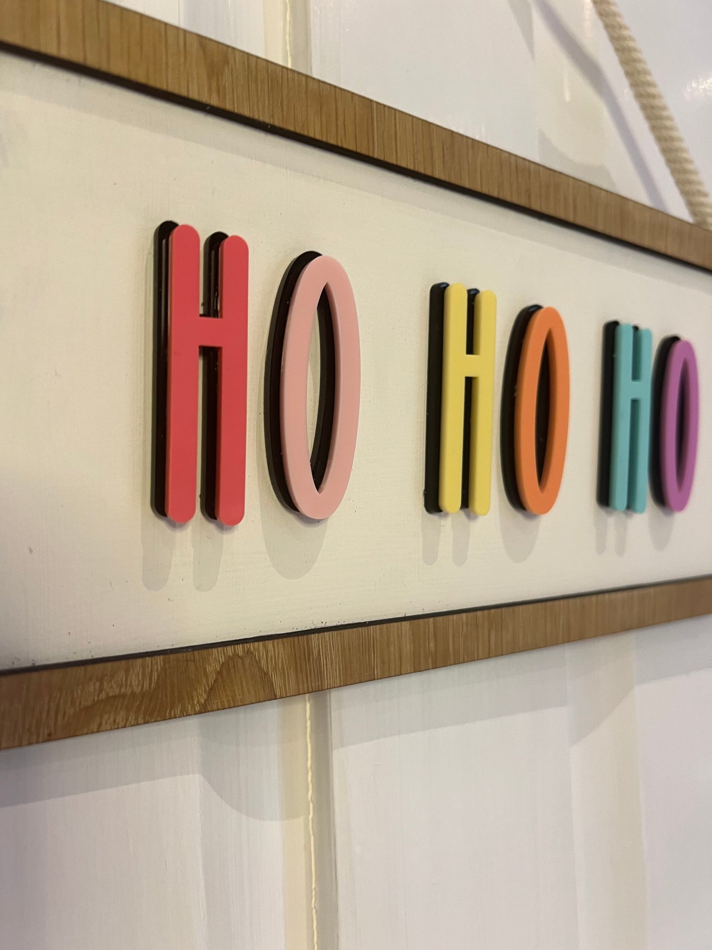 Colourful Ho Ho Ho hanging Christmas sign