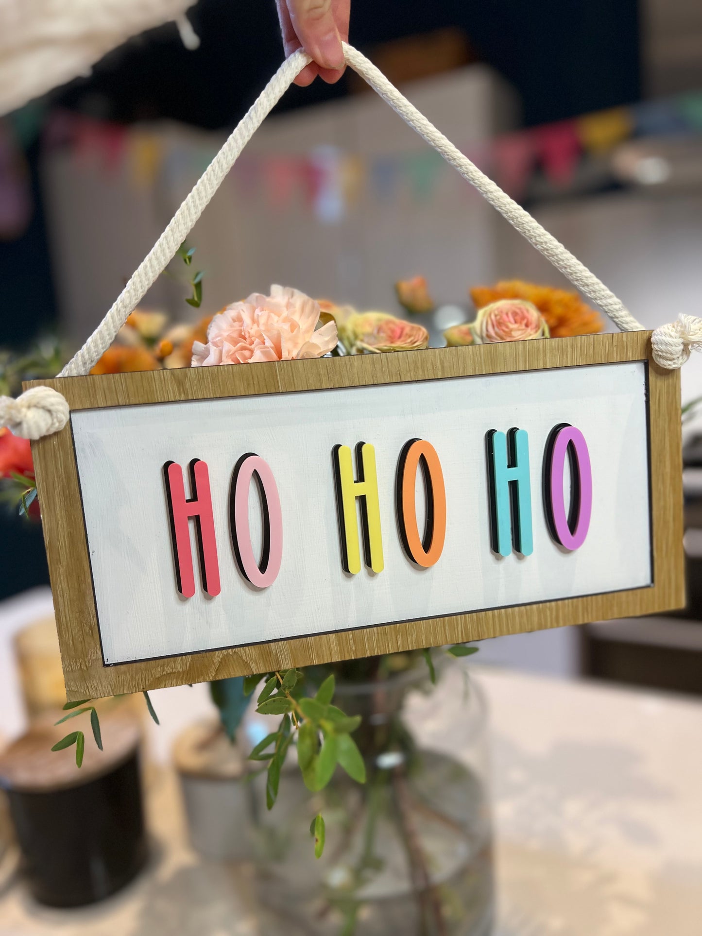 Colourful Ho Ho Ho hanging Christmas sign