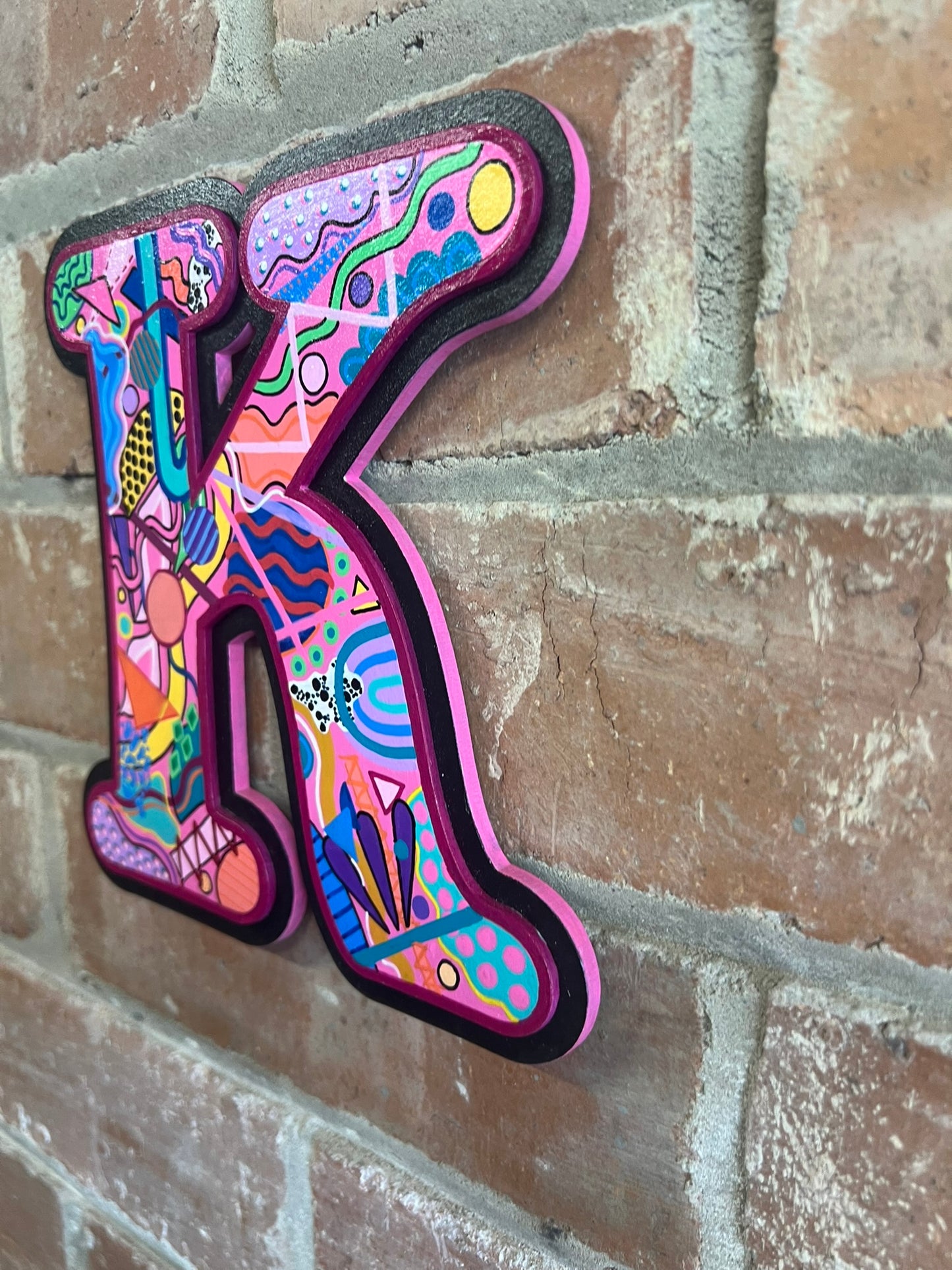 colourful Hand painted abstract memphis style 'K' Sign