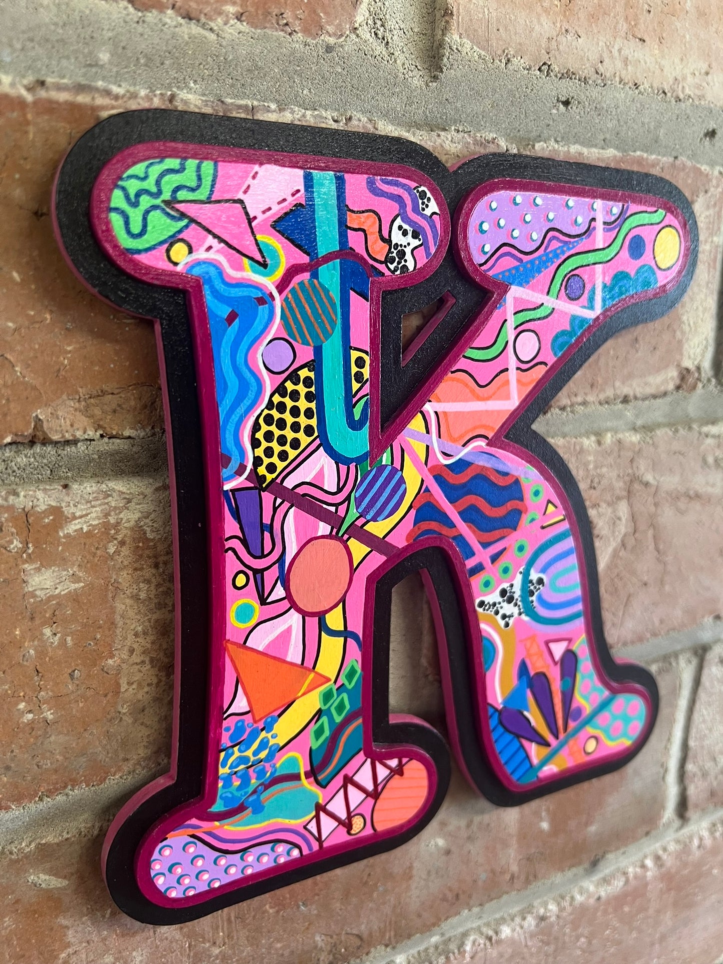 colourful Hand painted abstract memphis style 'K' Sign
